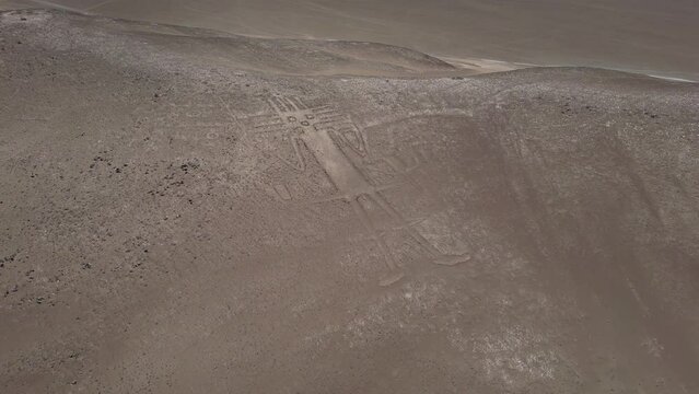 Tarapaca Giant its a large petroglyph on a rocky outcrop in the Atacama Desert, Tarapaca Region, northern Chile. It was created by native indigenous people of Chile in the year 900.
