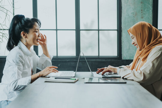 Happy multiethnic smiling business asian women working together in office, concept working woman.