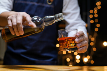 Bartender Serve Whiskey, on wood bar, 