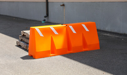 Vibrant construction cone amidst urban chaos signifies progress, safety, roadwork, caution, and...