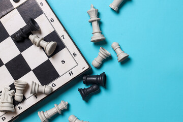 Top view of chess pieces battle on chessboard. Competition business strategy concept