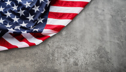 American flag freely lying on concrete board.