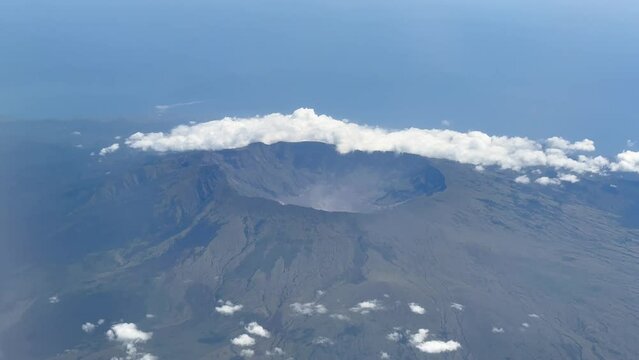 An aerial view looking into Tambora Volcano from the window Airplane