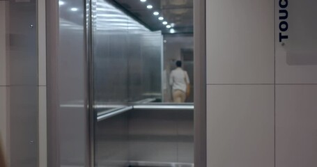Elevator door, floor and business people busy in an office for corporate or professional work. Lift, exit and a group of employees, colleagues or coworkers in the lobby of a company workplace