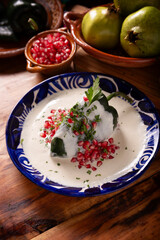 Chiles en Nogada, Typical dish from Mexico. Prepared with poblano chili stuffed with meat and...