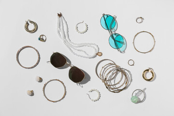 Jewelry with sunglasses on white background