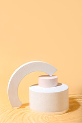 Plaster podiums in water on beige background