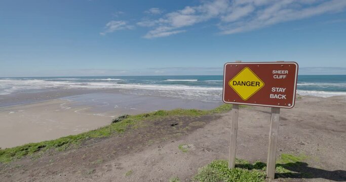 Coast danger stay back sign.