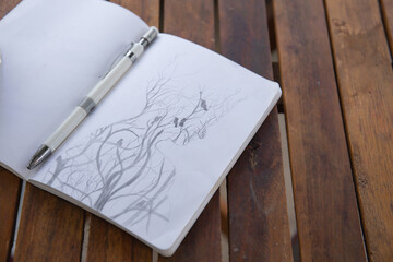 Photo of pencil sketch in the notebook 
