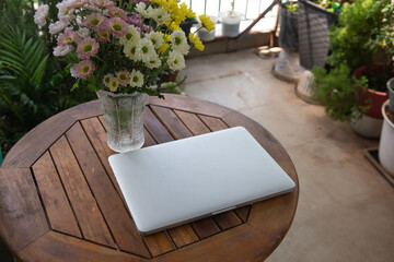 Photo of laptop in the garden.Working from home concept 