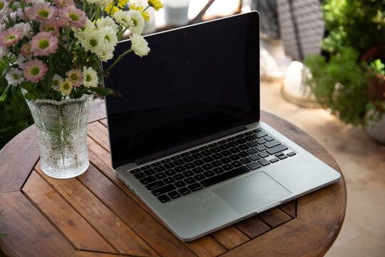Photo of laptop in the garden.Working from home concept 