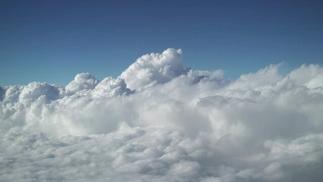 Turning above and around the clouds Aerial footage filmed from the plane