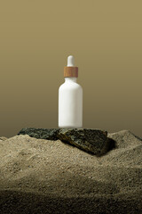 bottle container on a sand rock