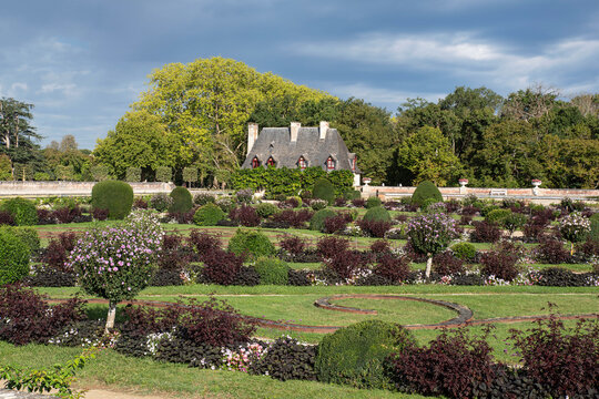 Landscape in the gardens of the Ch&acirc;teau de Chenonceau in France, with a picturesque little house in the background