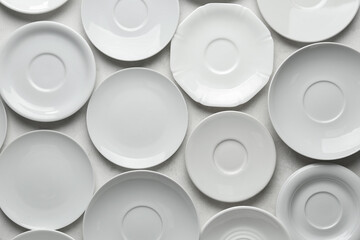 Many clean white plates on white background - Powered by Adobe