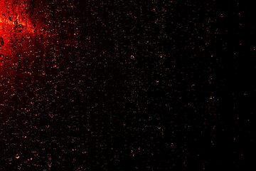 Black dark red orange brown shiny glitter abstract background with space. Twinkling glow stars...