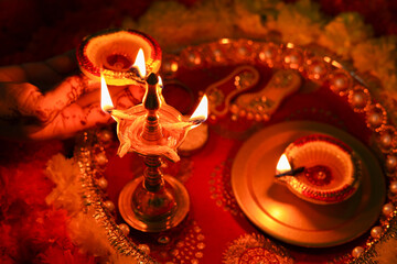 Onam Diwali vishu celebration Indian festival flowers marigold flowerbed lighted oil lamp...