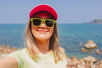 Happy colorful fashion asian woman on a summer beach travel trip.