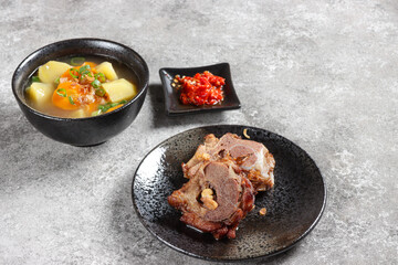 Buntut Sapi Goreng or Sop Buntut Goreng is Fried Oxtail Served with Soup.