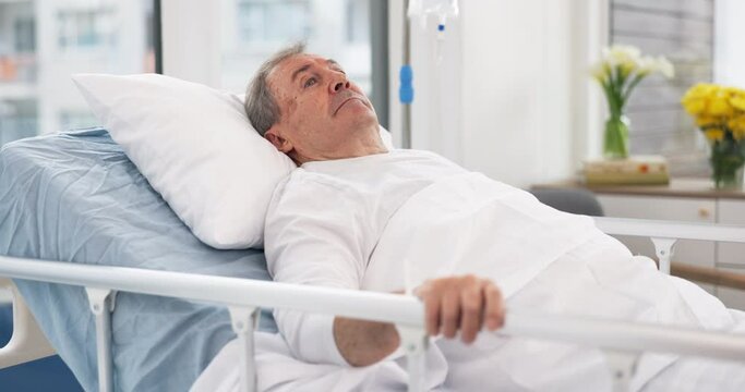 Man, cancer and patient in hospital bed thinking about healthcare, wellness and healing in clinic after surgery. Medical treatment, sick and person with health problem in hospice for recovery in icu