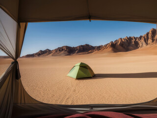 Fototapeta na wymiar A tent in the desert with mountains in the background