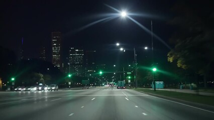 Driving car late at night in Chicago downtown