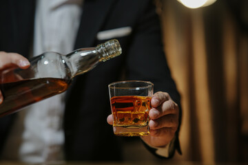Barman pouring whiskey whiskey glass beautiful night