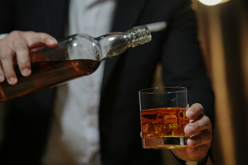 Barman pouring whiskey whiskey glass beautiful night