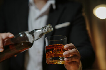 Barman pouring whiskey whiskey glass beautiful night