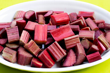 Fresh rhubarb on white plate