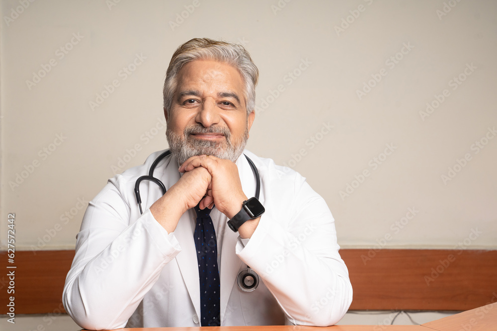 Wall mural Indian doctor in uniform with stethoscope at hospital