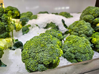 Pile of Fresh green broccoli in a supermarket local market, Bunch of organic broccoli. Fresh ripe green broccoli