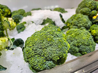 Pile of Fresh green broccoli in a supermarket local market, Bunch of organic broccoli. Fresh ripe green broccoli