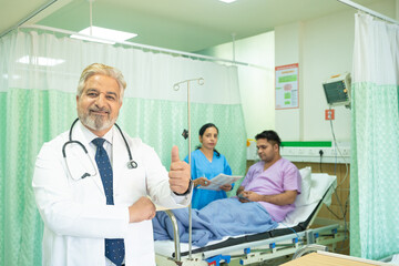 Doctor showing thumps up at hospital.