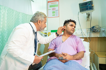Doctor checking patient at hospital.