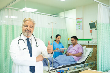 Fototapeta premium Doctor showing thumps up at hospital.