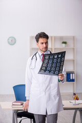 Young male doctor radiologist working in the clinic