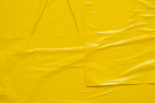 Blank yellow crumpled and creased paper poster texture background