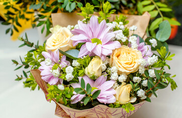 Obraz na płótnie Canvas Festive bouquet of roses and chrysanthemums