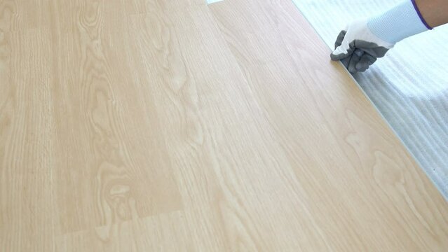 flooring installation and renovation. spc (Stone Plastic Composite) wooden texture surface. interior wooden flooring material