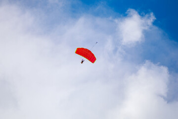 Jump in tandem skydivers-athletes with a parachute.