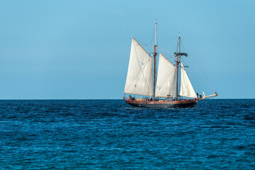 Fototapeta na wymiar old wooden sail ship , on the ocean off the coast of cornwall uk , landscap photo