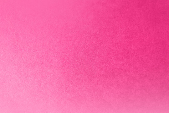 Hot classic pink tone color gradation with light soft shade paint on environmental friendly blank cardboard box paper texture background space minimal design