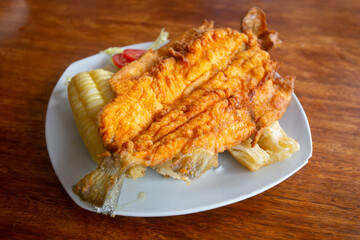 Chicharron de trucha. Traditional Andean recipe in Peru of fried trout served with cassava and...