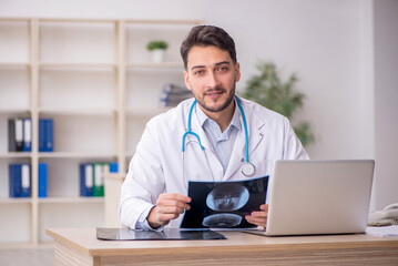 Young male doctor radiologist working in the clinic