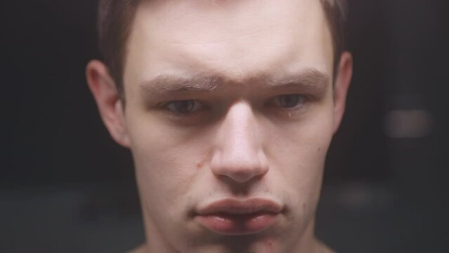 Closeup Face of a Young Man Grimacing