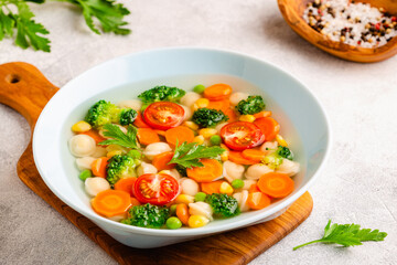 Soup with mini dumplings and vegetables.