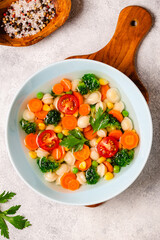 Soup with mini dumplings and vegetables.