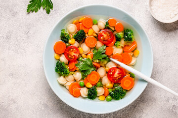 Soup with mini dumplings and vegetables.