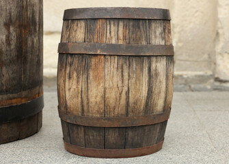 Traditional wooden barrel on street outdoors. Wine making